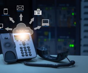 IP Telephony cloud pbx concept, telephone device with illustration icon of voip services and networking data center on background